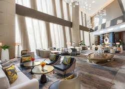 double volume lobby in Mandarin Oriental Dubai with seating and statement chandelier