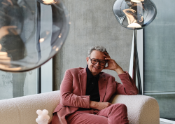 designer Tom Dixon on a couch discussing SANIPEX collaboration