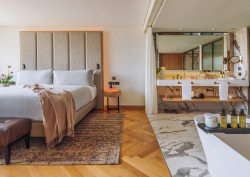 Melia hotels ME Lisbon guestroom with open plan bedroom and bathroom