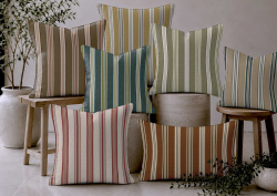 a pile of striped cushions in Poole stripe from Skopos
