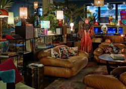 vintage lights in different shapes and colours, leather couch, plants and mannequin in 25hours Hotel The Trip redesign