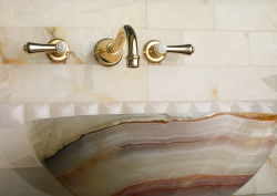 brass taps above marble basin from House of Rohl - Perrin & Rowe