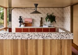 wood panel and terrazzo reception desk at Hotel Flinders with design by Studio Tate