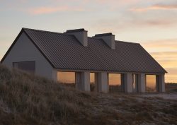 exterior view of Vipp-cold hawaii cottage in evening light