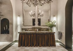 double vanity with double mirror and organic chandelier with brass leaves in the WOW!house bathroom design