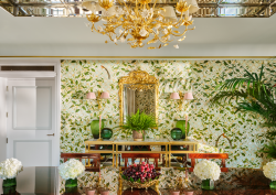 dining room with gold chandelier and garden trellis wallpaper in The dorchester Royal suite