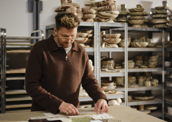 artist Henry Holland in ceramic studio working on Harlequin fabric collection