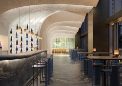 curved and layered ceiling running through bar in Nobu Toronto into lobby