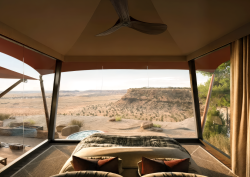 view across canyon from luxury tent at Six Senses Camp Korongo resort and residential community