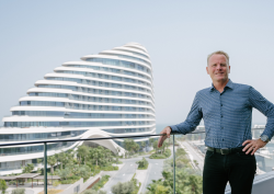 architect shaun Killa standing in front of Jumeirah Marsa Al Arab in Dubai