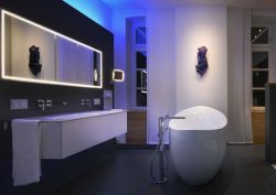 Blue-lit bathroom by Schluter-Systems