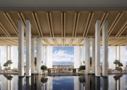 view across still pond through pillars to lanscape beyond in the EDITION hotel in Dali China