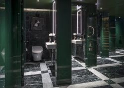 green marble bathroom with TOTO fittings at the Londoner hotel